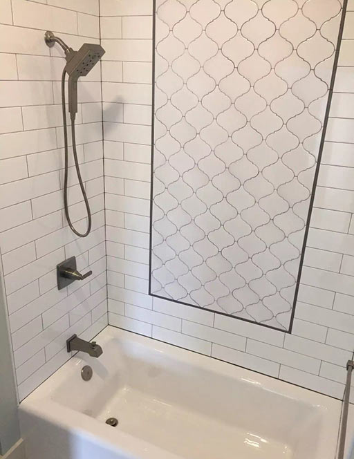 Subway Tile shower surround with unique removable square shower head.