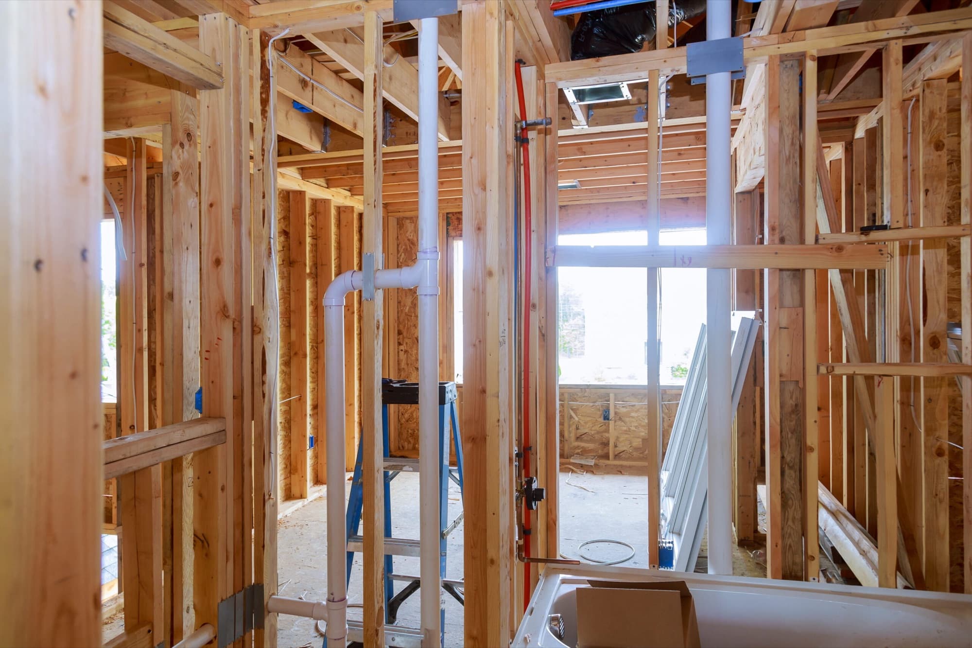 New construction framing with rough-in plumbing lines
