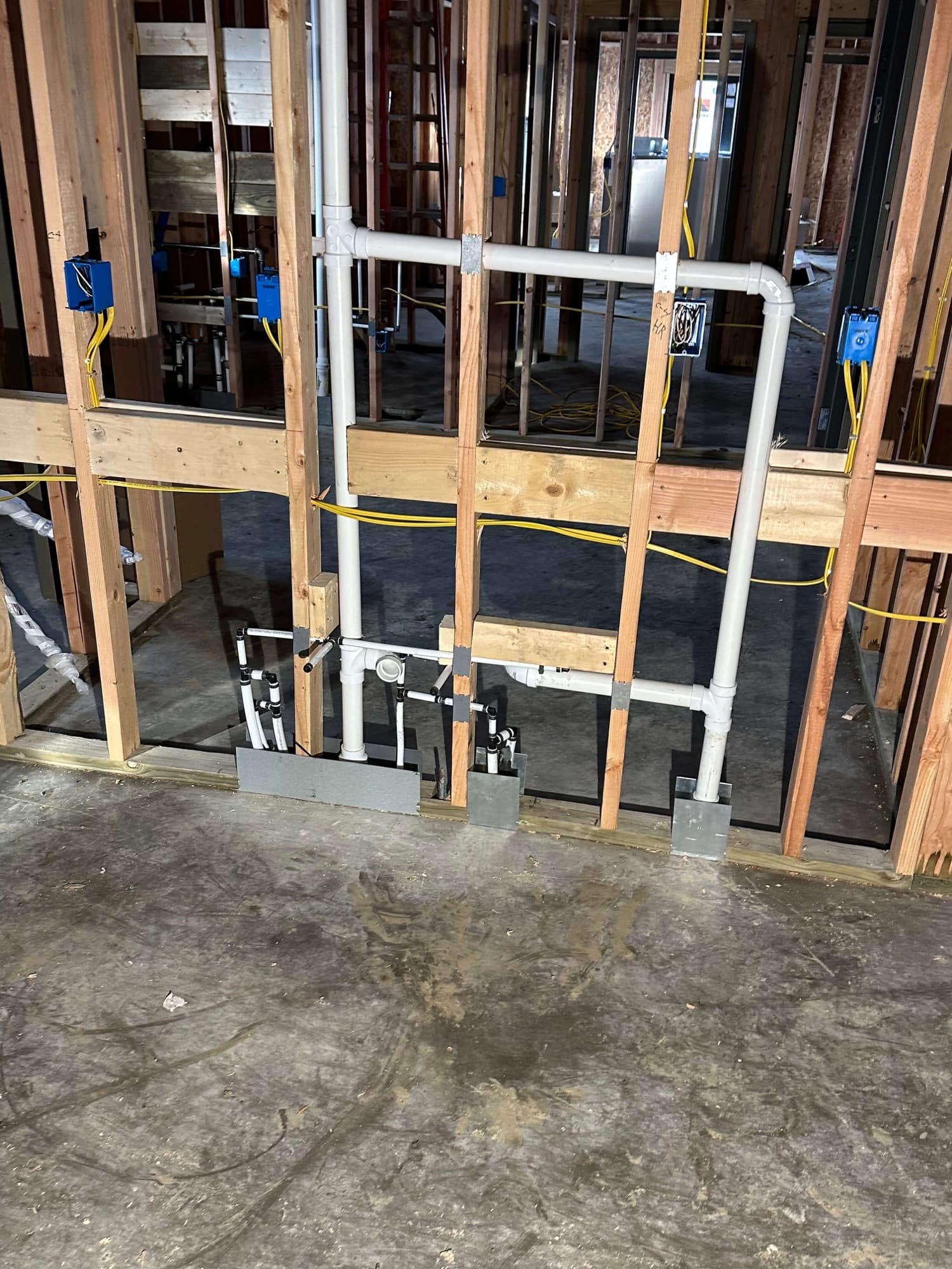 Drain and vent lines installed by Andrews Plumbing inside wall framing