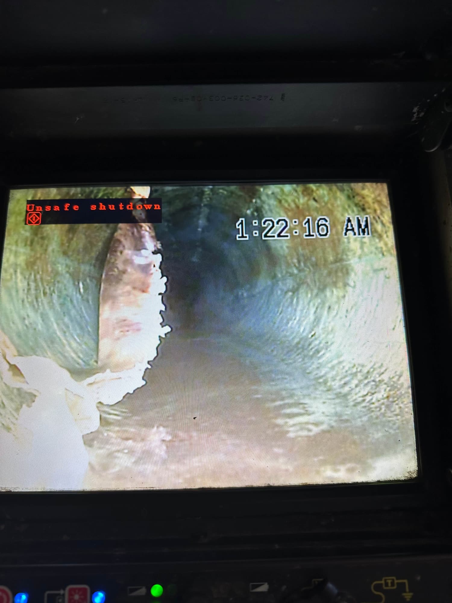 Sewer camera monitor showing the inside of a drain line
