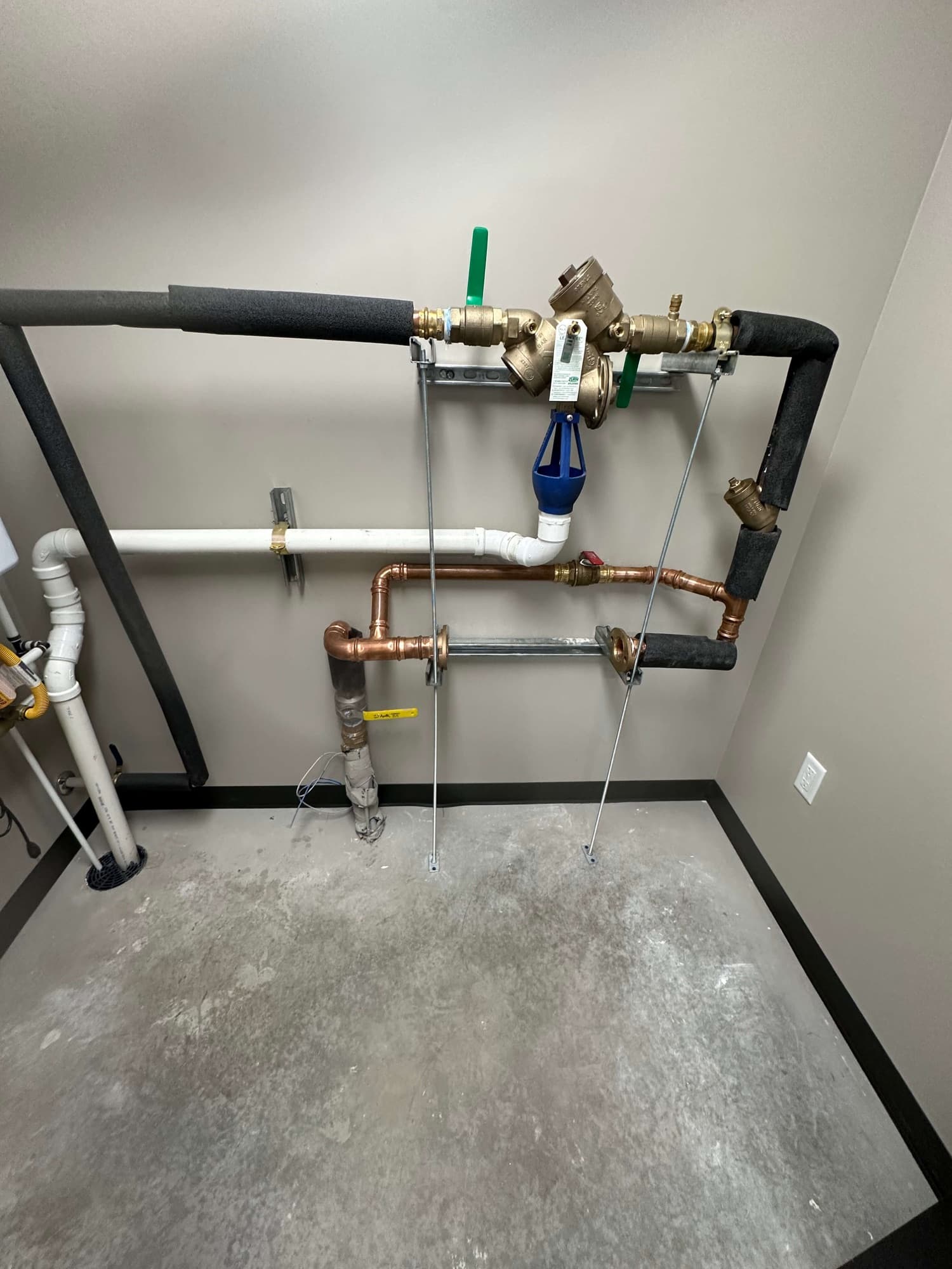 Utility room supply plumbing installed by Andrews Plumbing