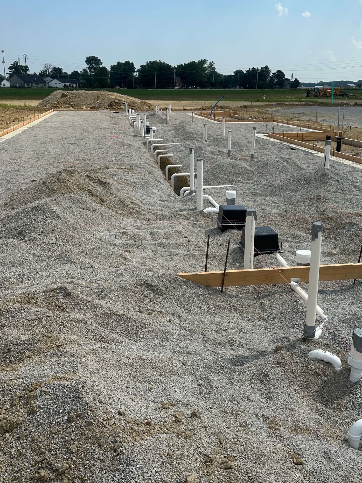 Underground plumbing runs on a commercial site