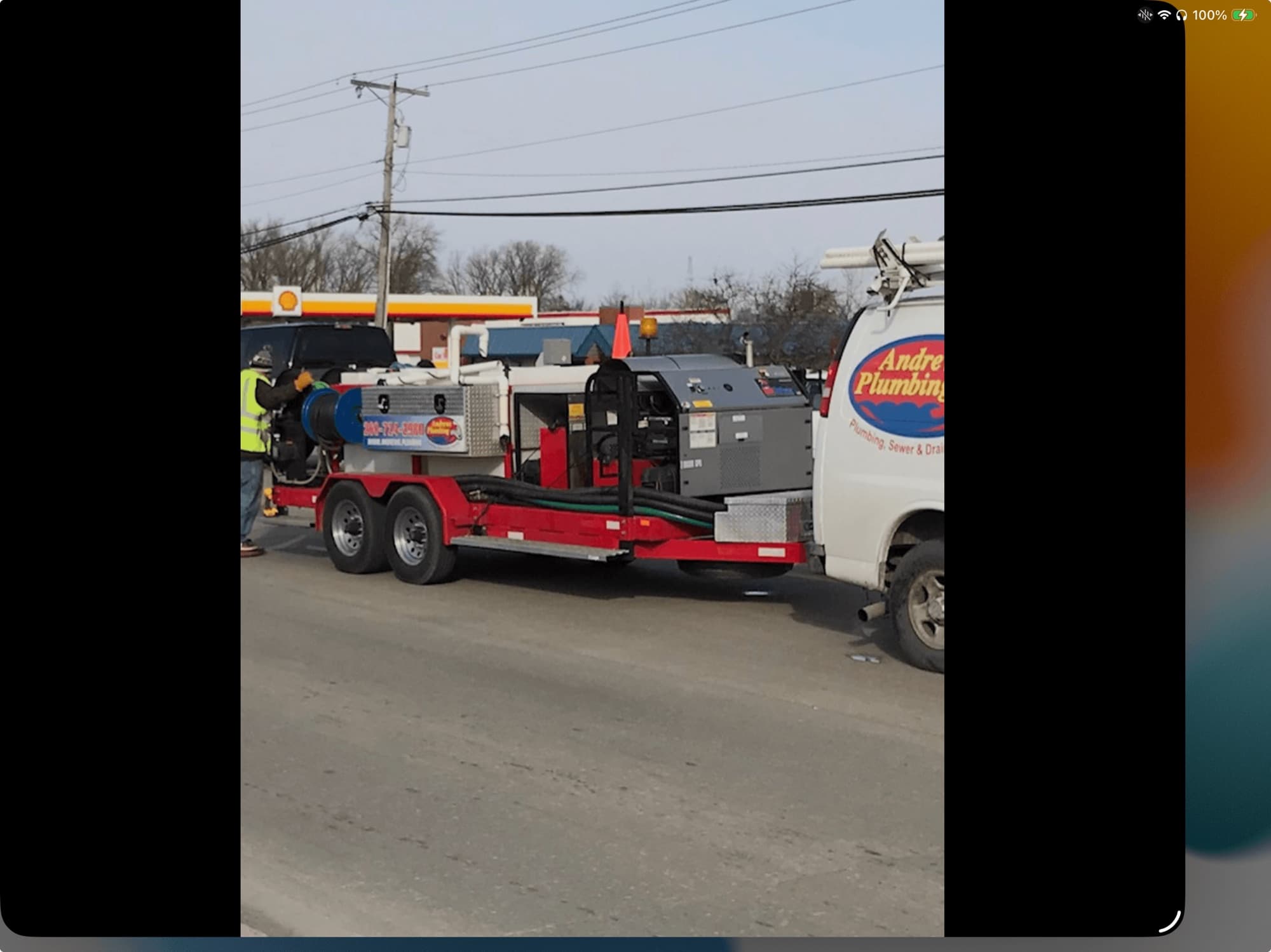 Andrews Plumbing hydro jetting trailer and service truck on a job